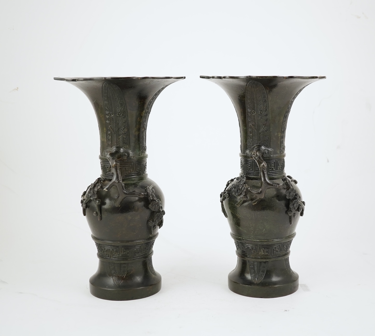 A pair of Chinese bronze gu-shaped vases, Qing dynasty